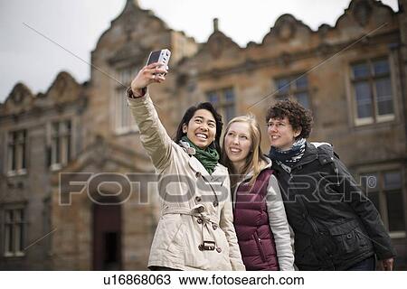 Students taking pictures of themselves View Large Photo Image Stock Image - Students taking pictures of themselves. Fotosearch