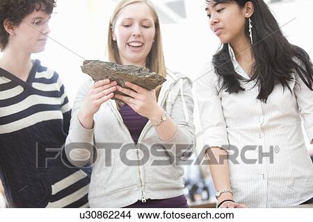 Picture - Students working in geology lab. Fotosearch