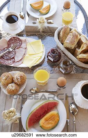 Stock Image - Table laid with breakfast. Fotosearch