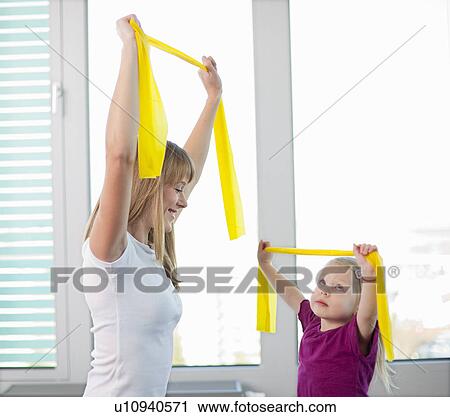 Trainer working with girl in gym View Large Photo Image Stock Image - Trainer working with girl in gym. Fotosearch