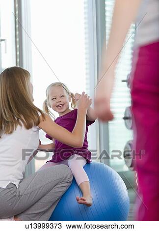 Trainer working with girl in gym View Large Photo Image Stock Image - Trainer working with girl in gym. Fotosearch