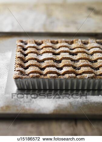 Stock Image - Tray of baked fruit tart. Fotosearch