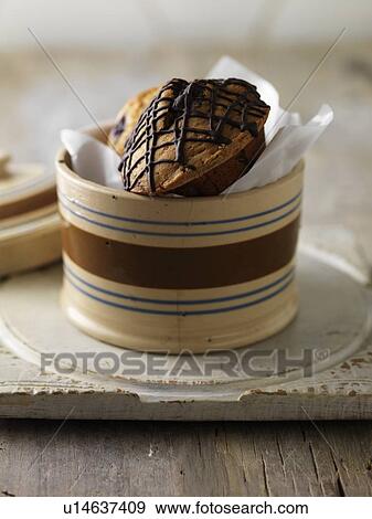 Stock Photo - Various muffins in jar. Fotosearch