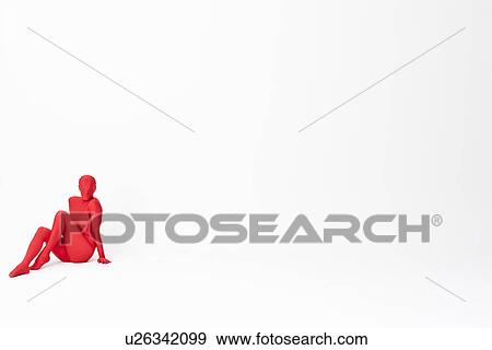 Stock Photo - Woman in bodysuit sitting on floor. Fotosearch