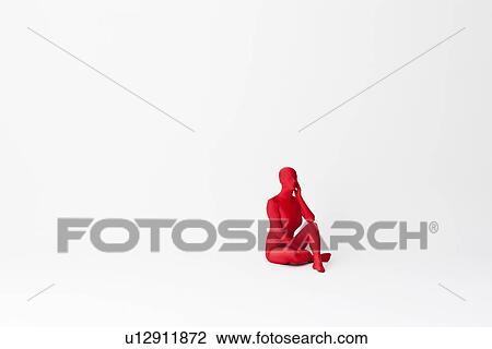 Stock Image - Woman in bodysuit talking on phone. Fotosearch