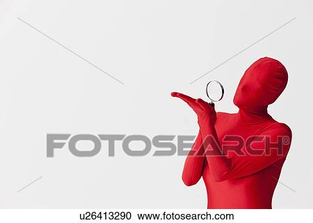 Woman in bodysuit with magnifying glass View Large Photo Image Stock Image - Woman in bodysuit with magnifying glass. Fotosearch