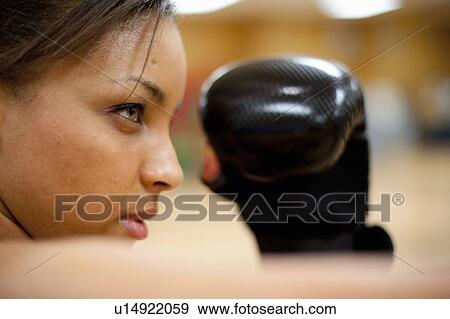 Woman kick boxing in gym View Large Photo Image Stock Photo - Woman kick boxing in gym. Fotosearch