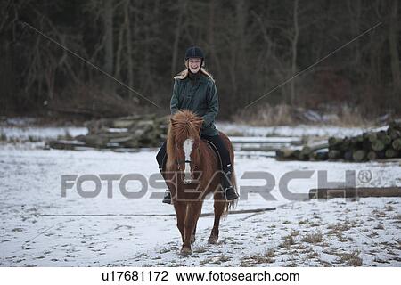 Woman riding horse in snow View Large Photo Image Stock Image - Woman riding horse in snow. Fotosearch