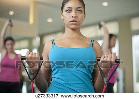 Woman stretching in gym View Large Photo Image Stock Photo - Woman stretching in gym. Fotosearch