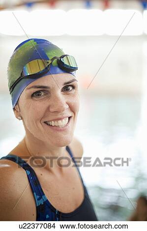 Picture - Woman wearing swim gear at pool. Fotosearch