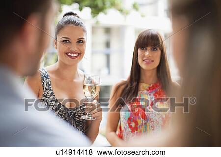 Women talking in group at party View Large Photo Image Stock Photo - Women talking in group at party. Fotosearch