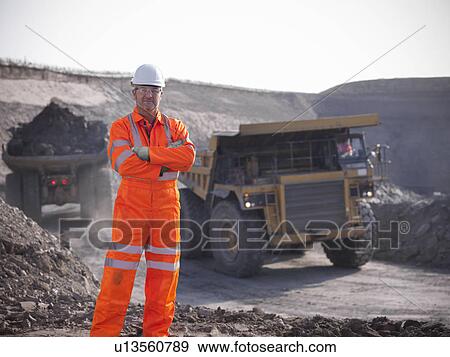 Worker standing at coal mine View Large Photo Image Stock Photo - Worker standing at coal mine. Fotosearch