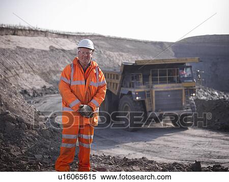 Worker standing at coal mine View Large Photo Image Stock Photography - Worker standing at coal mine. Fotosearch