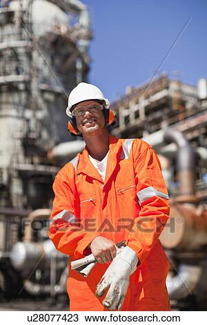 Worker with gloves at oil refinery View Large Photo Image Stock Image - Worker with gloves at oil refinery. Fotosearch