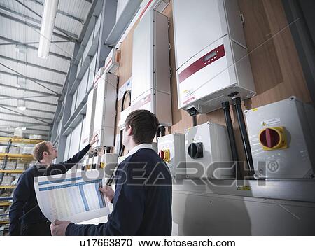 Workers checking solar panel controls View Large Photo Image Stock Image - Workers checking solar panel controls. Fotosearch
