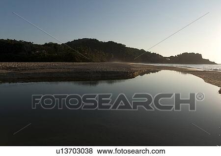 Stock Photo - Beach at sunrise, Sayulita, Nayarit, Mexico. Fotosearch