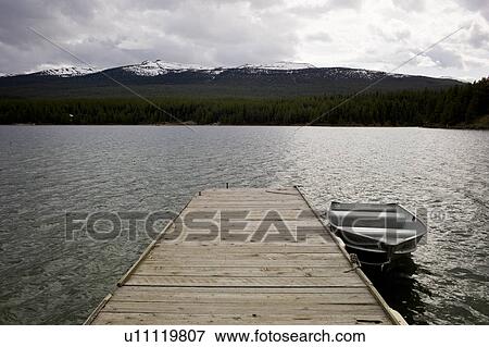 Boat at a dock in Maligne Lake, Jasper National Park, Alberta, Canada View Large Photo Image Stock Photo - Boat at a dock in Maligne Lake, Jasper National Park, Alberta, Canada. Fotosearch