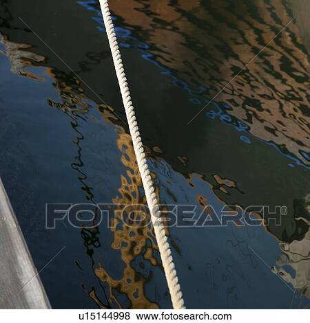 Boat reflection on rippled water, Skeppsholmen Island, Stockholm, Sweden View Large Photo Image Stock Photo - Boat reflection on rippled water, Skeppsholmen Island, Stockholm, Sweden. Fotosearch