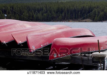 Stock Image - Boats at Curly Phillips Boathouse in Maligne Lake, Jasper National Park, Alberta, Canada. Fotosearch