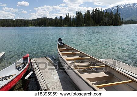 Boats docked in Beauvert Lake, Jasper National Park, Alberta, Canada View Large Photo Image Stock Photo - Boats docked in Beauvert Lake, Jasper National Park, Alberta, Canada. Fotosearch