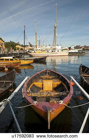 Boats moored at a harbor, Skeppsholmen, Stockholm, Sweden View Large Photo Image Stock Image - Boats moored at a harbor, Skeppsholmen, Stockholm, Sweden. Fotosearch