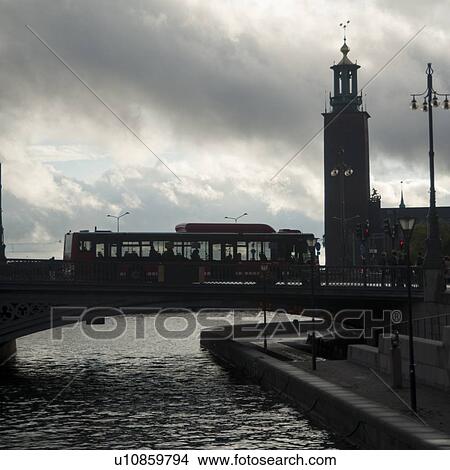 Bus crossing a bridge with Stockholm Town Hall in the background, Riddarfjarden, Stockholm, Sweden View Large Photo Image Picture - Bus crossing a bridge with Stockholm Town Hall in the background, Riddarfjarden, Stockholm, Sweden. Fotosearch
