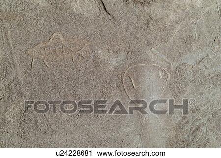 Stock Image - Cave painting on a rock, Utah, USA. Fotosearch