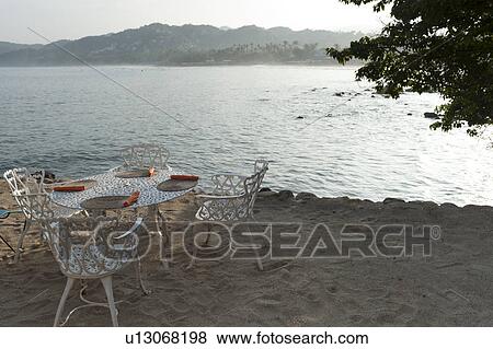 Stock Photo - Chairs and table in a restaurant, Sayulita, Nayarit, Mexico. Fotosearch
