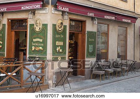 Stock Photo - Chairs and tables at a cafe, Gamla Stan, Stockholm, Sweden. Fotosearch