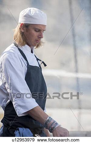 Stock Photo - Chef cooking in the kitchen, Stockholm, Sweden. Fotosearch