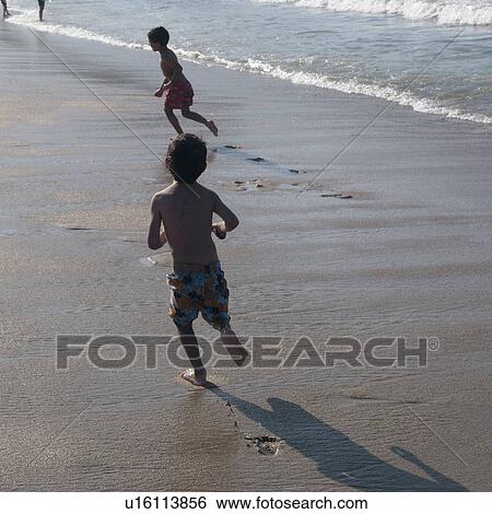 Children playing on the beach, Sayulita, Nayarit, Mexico View Large Photo Image Stock Photograph - Children playing on the beach, Sayulita, Nayarit, Mexico. Fotosearch