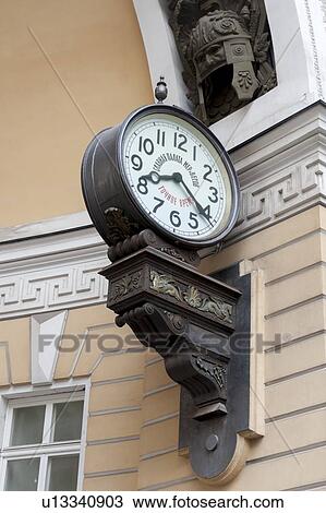 Stock Image - Clock on Triumphal Arch of General Staff Building, State Hermitage Museum, Palace Square, St. Petersburg, Russia. Fotosearch