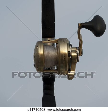 Stock Image - Close-up of a fishing reel, Sayulita, Nayarit, Mexico. Fotosearch