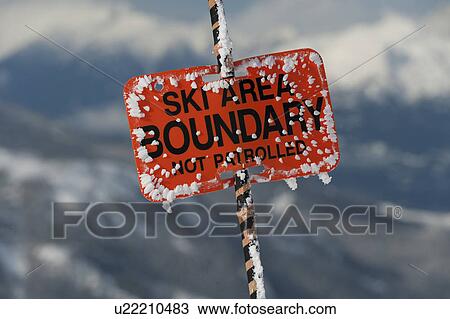 Stock Image - Close-up of a ski area boundary sign, Whistler, British Columbia, Canada. Fotosearch