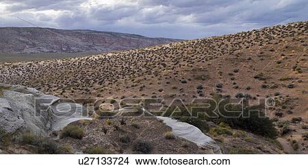 Picture - Clouds over a desert, Amangiri, Canyon Point, Hoodoo Trail, Utah, USA. Fotosearch