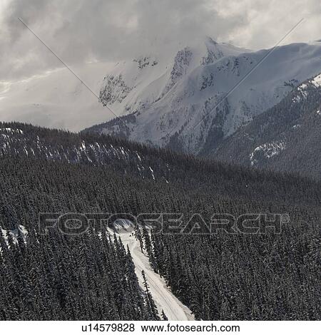 Clouds over snow covered mountains, Whistler, British Columbia, Canada View Large Photo Image Stock Photo - Clouds over snow covered mountains, Whistler, British Columbia, Canada. Fotosearch
