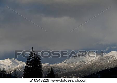 Clouds over snow covered mountains, Whistler, British Columbia, Canada View Large Photo Image Stock Photo - Clouds over snow covered mountains, Whistler, British Columbia, Canada. Fotosearch