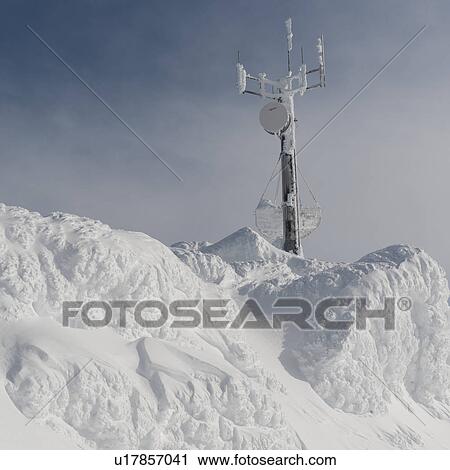 Stock Image - Communication tower on a snow covered mountain, Whistler, British Columbia, Canada. Fotosearch