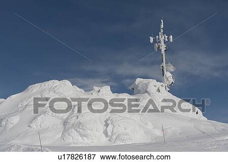 Stock Photo - Communication tower on a snow covered mountain, Whistler, British Columbia, Canada. Fotosearch