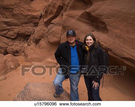 Couple at a slot canyon, Tse Bighanilini, Upper Antelope Canyon, Antelope Canyon, Page, Arizona, USA View Large Photo Image Stock Photograph - Couple at a slot canyon, Tse Bighanilini, Upper Antelope Canyon, Antelope Canyon, Page, Arizona, USA. Fotosearch