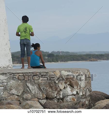 Couple on a rock, Sayulita, Nayarit, Mexico View Large Photo Image Stock Image - Couple on a rock, Sayulita, Nayarit, Mexico. Fotosearch