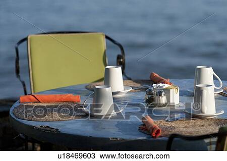 Stock Image - Cups and plates on a table, Sayulita, Nayarit, Mexico. Fotosearch