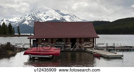 Curly Phillips Boathouse in Maligne Lake, Jasper National Park, Alberta, Canada View Large Photo Image Stock Photo - Curly Phillips Boathouse in Maligne Lake, Jasper National Park, Alberta, Canada. Fotosearch