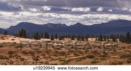 Desert with mountain range in the background, Coral Pink Sand Dunes State Park, Utah, USA View Large Photo Image Stock Photography - Desert with mountain range in the background, Coral Pink Sand Dunes State Park, Utah, USA. Fotosearch