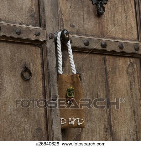 Stock Photography - Do Not Disturb sign hanging on a door, Sayulita, Nayarit, Mexico. Fotosearch