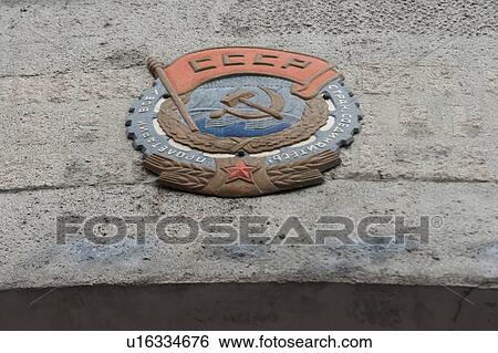 Stock Photograph - Emblem carving on a wall, St. Petersburg, Russia. Fotosearch