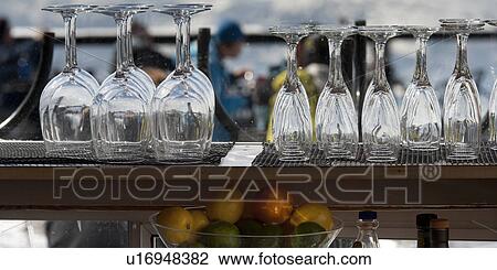 Empty wine glasses and champagne flutes at bar counter, Whistler, British Columbia, Canada View Large Photo Image Stock Image - Empty wine glasses and champagne flutes at bar counter, Whistler, British Columbia, Canada. Fotosearch