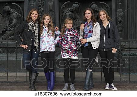 Family standing in front of a carved door of the Saint Isaac's Cathedral, St. Isaac's Square, St. Petersburg, Russia View Large Photo Image Stock Photograph - Family standing in front of a carved door of the Saint Isaac's Cathedral, St. Isaac's Square, St. Petersburg, Russia. Fotosearch