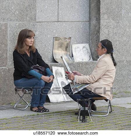 Female artist drawing a portrait of a woman on a street, Palace Square, St. Petersburg, Russia View Large Photo Image Stock Image - Female artist drawing a portrait of a woman on a street, Palace Square, St. Petersburg, Russia. Fotosearch