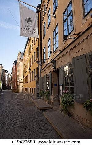 Flag over Den Gyldene Freden restaurant in a street, Gamla Stan, Stockholm, Sweden View Large Photo Image Stock Photo - Flag over Den Gyldene Freden restaurant in a street, Gamla Stan, Stockholm, Sweden. Fotosearch